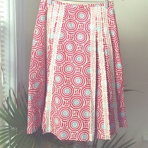 1 A-line knee length pattern skirt. Size (s)